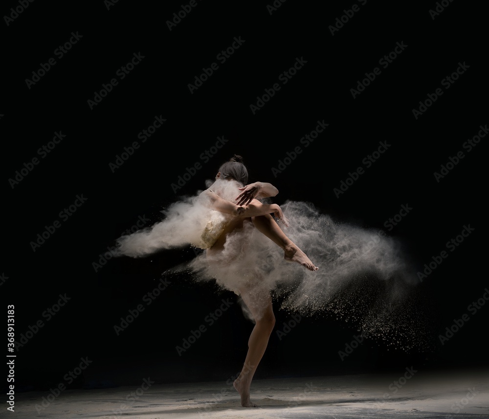Graceful lady in body dance in cloud of dust - obrazy, fototapety, plakaty 
