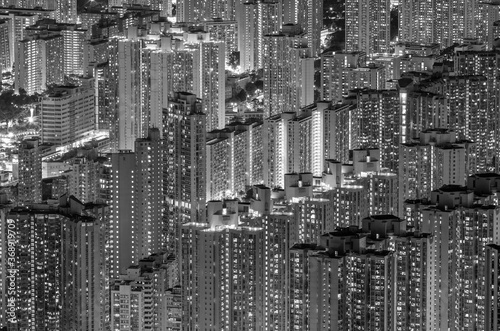 Aerial view of crowded residential building in Hong Kong city at night