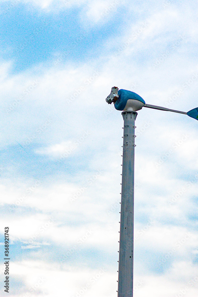 Fototapeta premium wind turbine against blue sky