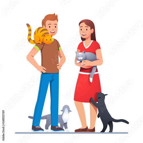 Two cat lovers meeting with their pets and talking