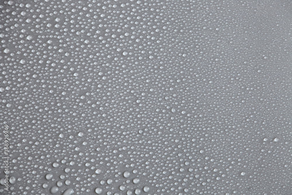 Water drops on light background, top view, close-up, macro. Great background with natural water drops and natural light Water drops on light background, top view, close-up, macro. Great background with natural water drops and natural light
