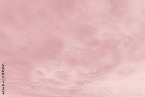 Beautiful sky with cirrocumulus clouds, pink coral watercolor toned