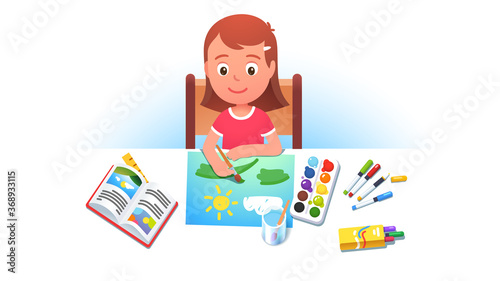 Girl kid sitting at table, painting summer picture