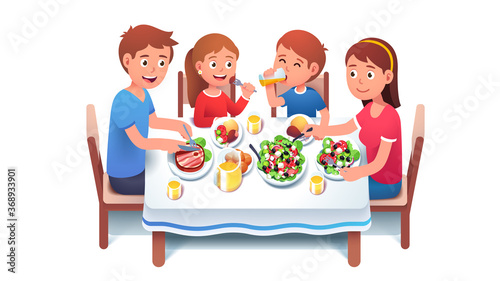 Family having dinner meal together at home