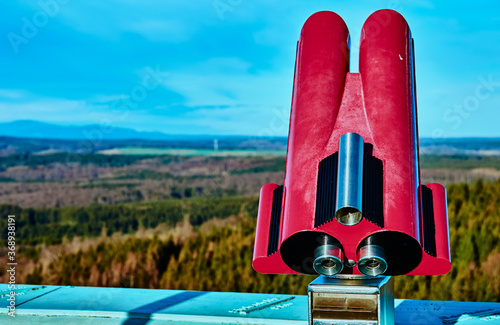 Binoculars   for detailed observation and viewing of the landscape with fords and mountains in the southern Harz around Auerberg and Stolberg photo
