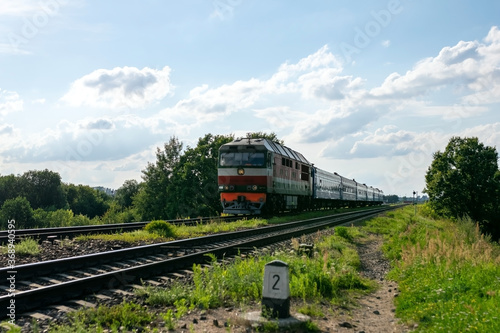 Out of date passenger train outside the city.