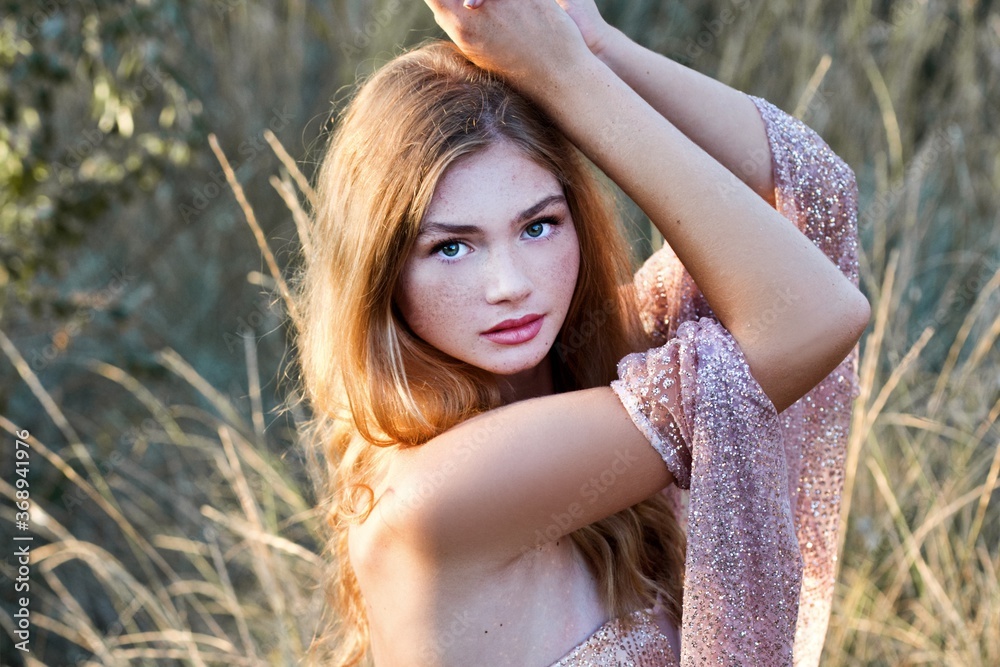 Beautiful girl with freckles. Bride with bouquet on sunset outdoor. Boho style. Series. Beautiful girl with freckles. Bride with bouquet on sunset outdoor. Boho style. Series.