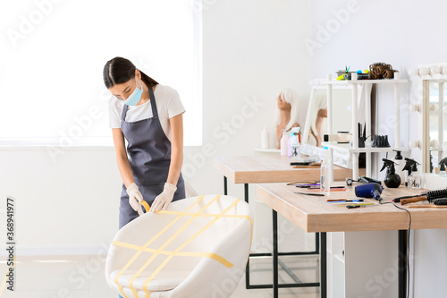 Female hairdresser applying...