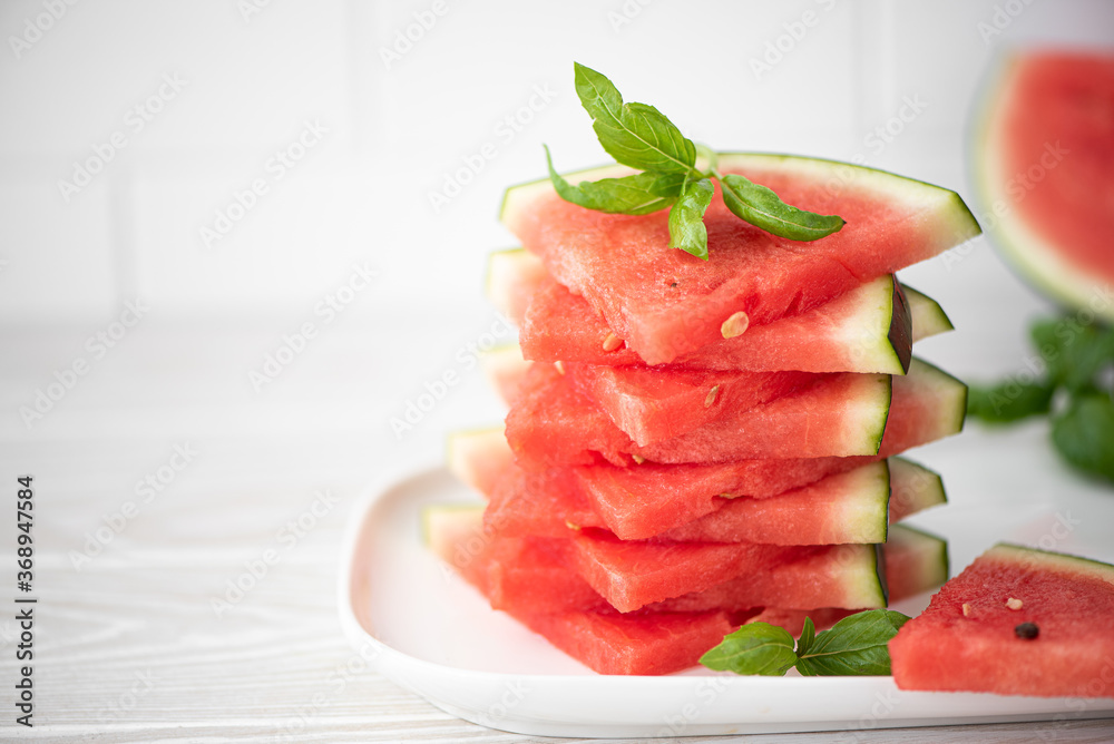ripe red watermelon cut into slices
