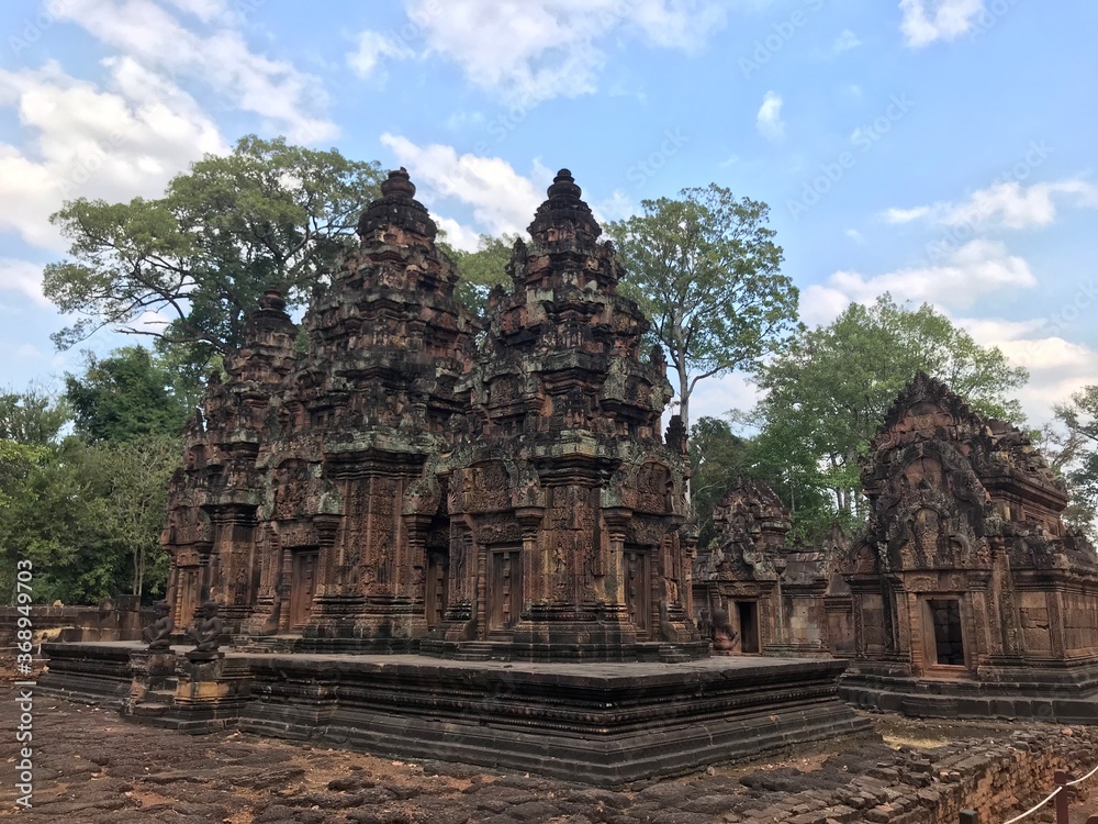 Historic Site in Cambodia, Citadel of the women, the pink color of the limestone and the elaborate decorative carvings of many female deities that grace its walls.  