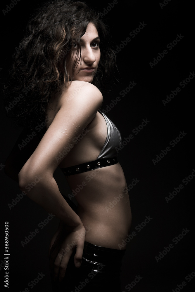 brunette woman dance on black background