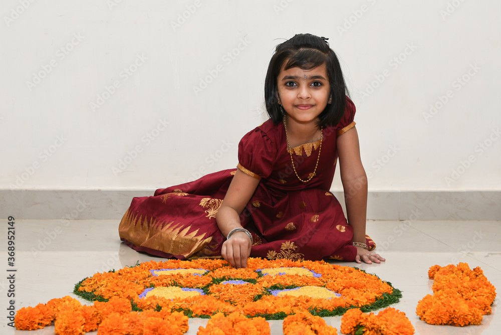 Kerala Onam festival, happy young Indian girl child, wearing