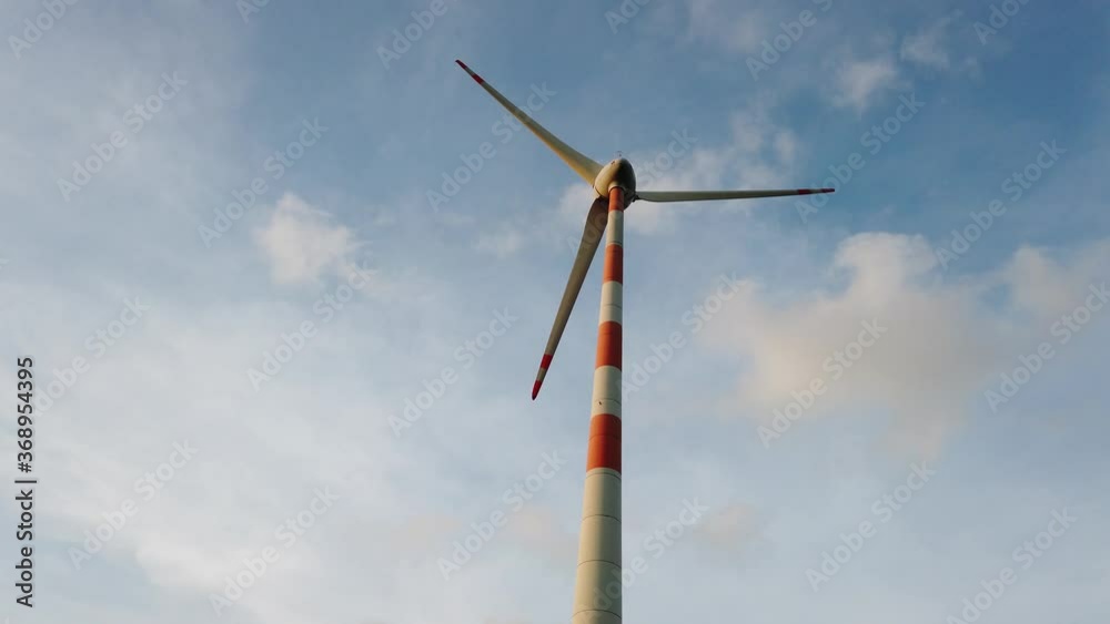 Windmill from a wind farm in India, natural renewable energy, clean and green energy to power homes - footage for presentation. Windmill from a wind farm in India, natural renewable energy, clean and green energy to power homes - footage for presentation.
