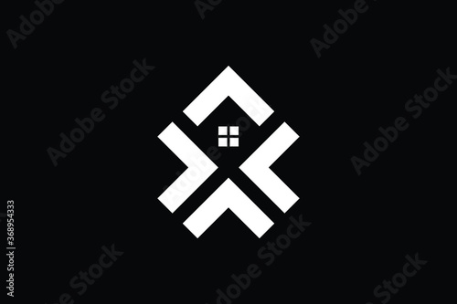 Logo design of X XX in vector for construction, home, real estate, building, property. creative elegant Monogram. Premium Business home logo icon. White color on black background