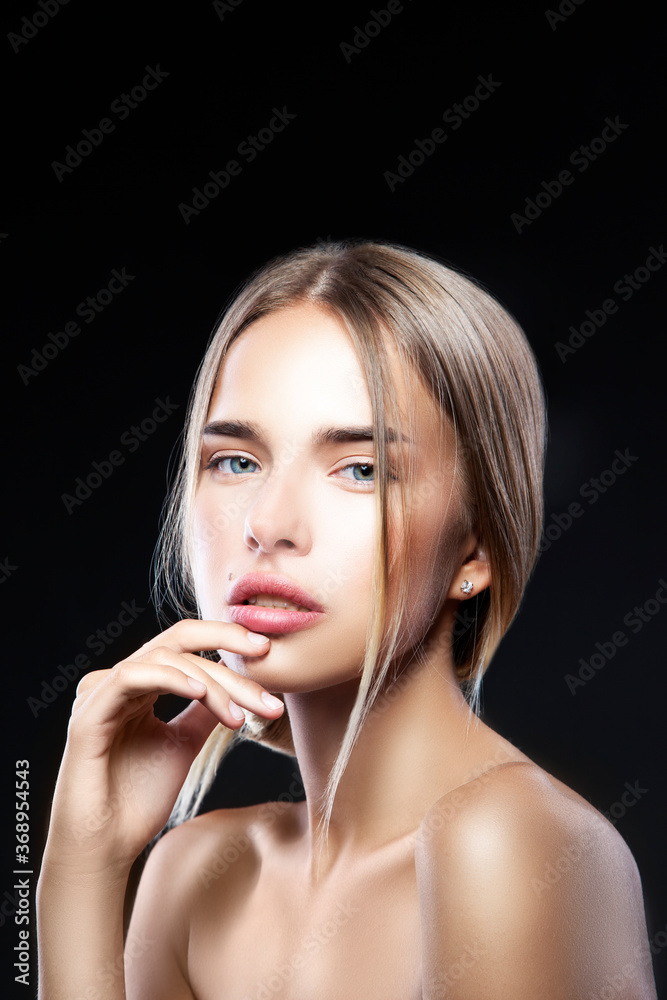 Beautiful fashion model woman bauty portrait. Perfect skin, nude make-up,  blonde hair. Black background Stock Photo | Adobe Stock