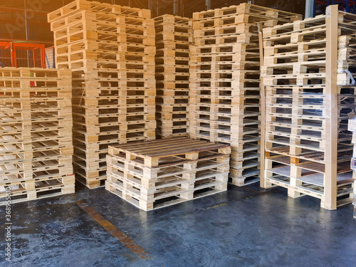 Wooden pallets stack at the freight cargo warehouse storage for shipment box container in transportation and logistics industrial 