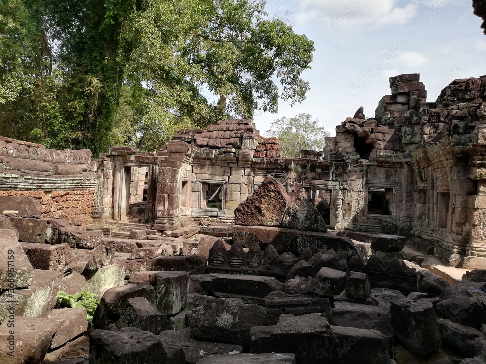 The temple of Preah Khan is one of the largest complexes at Angkor, a maze of vaulted corridors, fine carvings and lichen-clad stonework.   