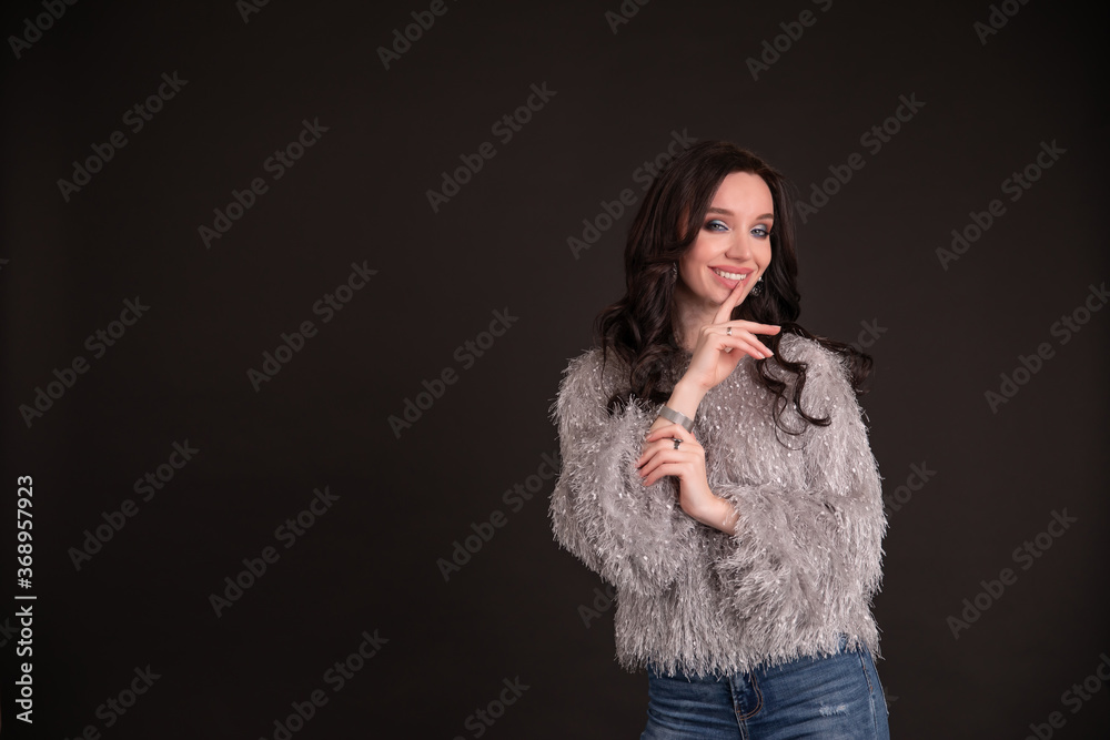 Beautiful girl on a black background. copy space.