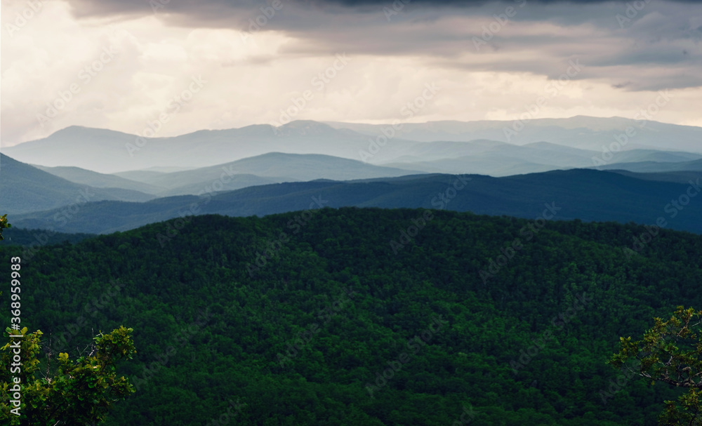 Rain over forest mountains. Misty mountain landscape hills at rainy day. Rain over forest mountains. Misty mountain landscape hills at rainy day.
