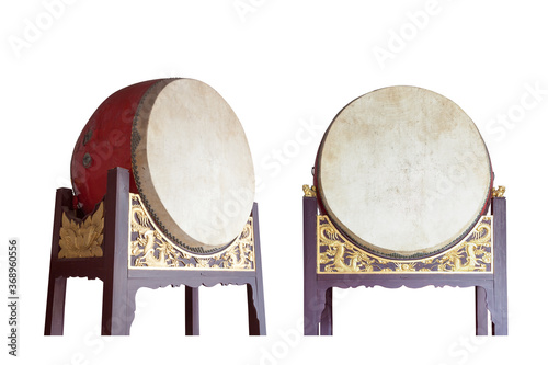 Traditional Chinese big drums on wooden frame with dragon relief isolated on the white background, this traditional drums were usually pounded  in sacrificial rites or festivals in ancient times