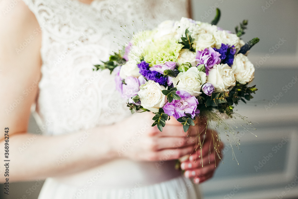Wedding bouquet of the bride in women's hands. wedding flowers. Bridal bouquet of fresh flowers, wedding concept