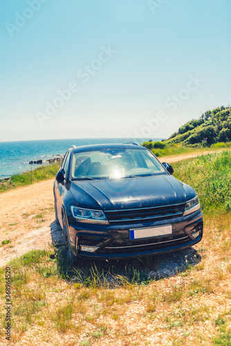 Fototapeta Naklejka Na Ścianę i Meble -  view of the car at sea summer beach