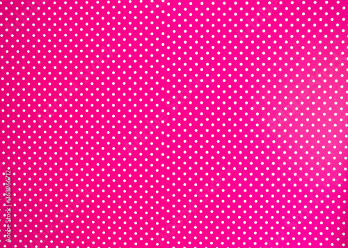 Pink background texture with white polka dots, Pink and white spot pattern can be used for background retro modern design