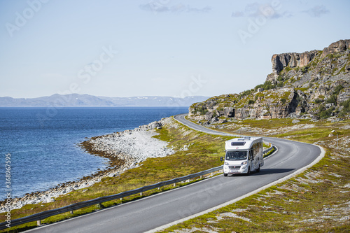 Valokuva A travel caravan aka camper van vehicle on the scenic county road 889 to Havøysu