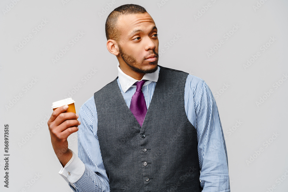 Young african american businessman holding coffee to go Young african american businessman holding coffee to go
