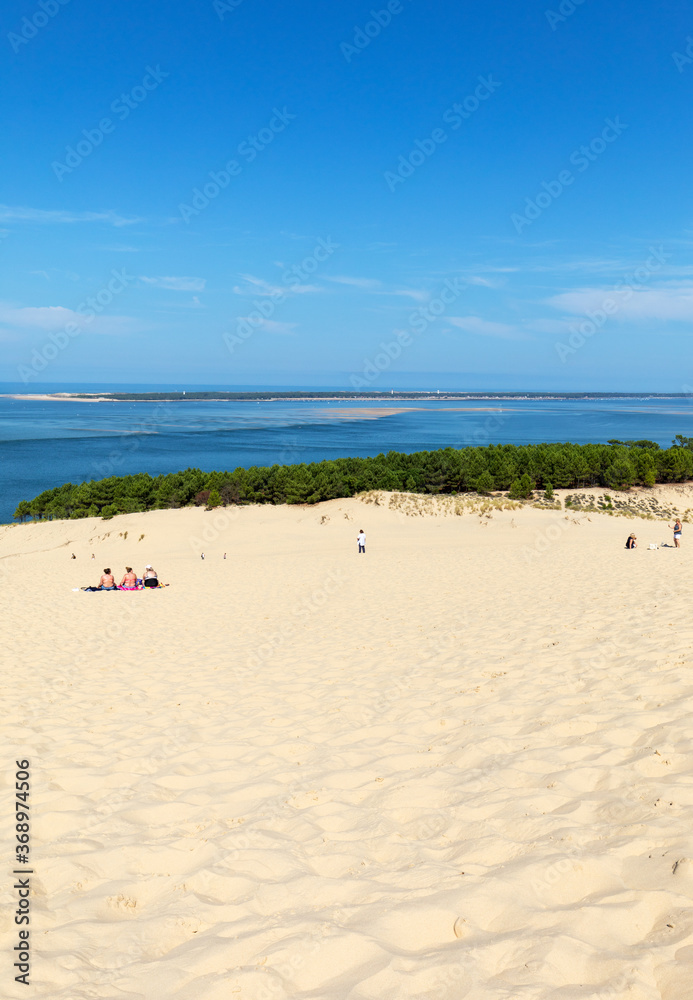 People on the Dune of Pilat, the tallest sand dune in Europe. La Teste-de-Buch, Arcachon Bay, Aquitaine, France People on the Dune of Pilat, the tallest sand dune in Europe. La Teste-de-Buch, Arcachon Bay, Aquitaine, France
