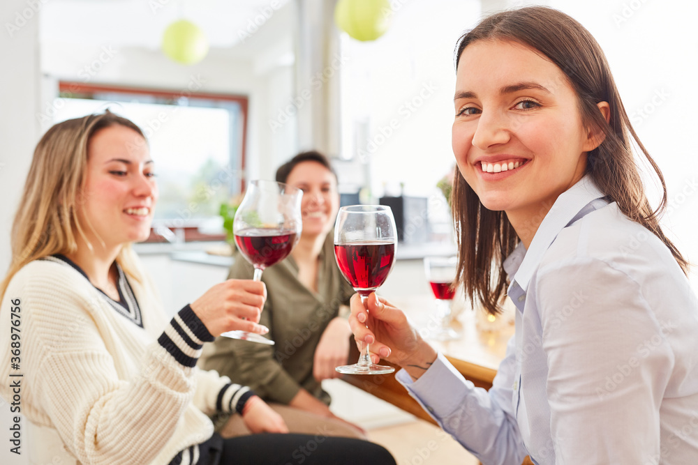 Group of women as friends talk over glass of red wine Group of women as friends talk over glass of red wine