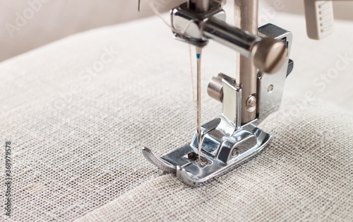 Close-up of modern sewing machine presser foot and needle
