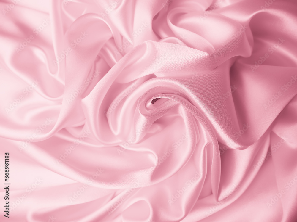 Fototapeta premium Beautiful elegant wavy light pink satin silk luxury cloth fabric texture, abstract background design.