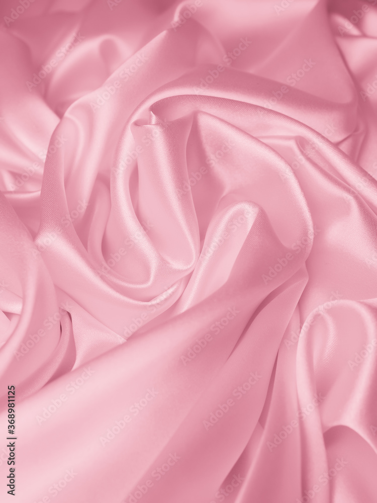 Beautiful elegant wavy light pink satin silk luxury cloth fabric texture,  abstract background design. Stock Photo