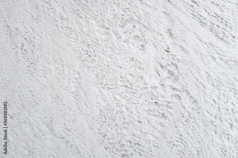 Surface of natural travertine, formed during ages by constant flowing mineral water Surface of natural travertine, formed during ages by constant flowing mineral water