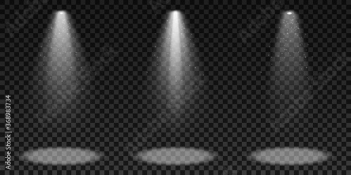 Spotlights isolated on a dark transparent background. A set of light effects. Elements for show and stage. Glowing particles. Vector illustration.