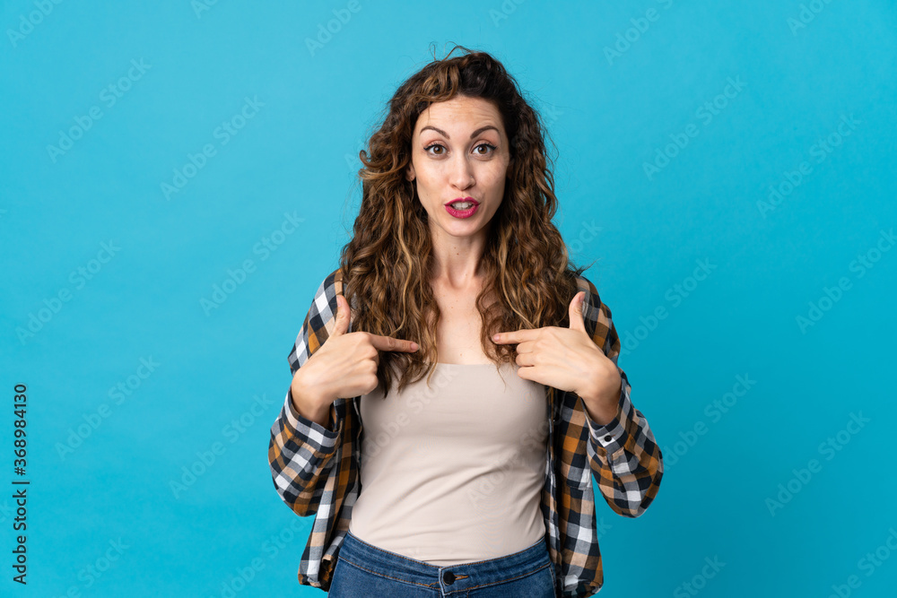 Young caucasian woman isolated on blue background with surprise facial expression Young caucasian woman isolated on blue background with surprise facial expression