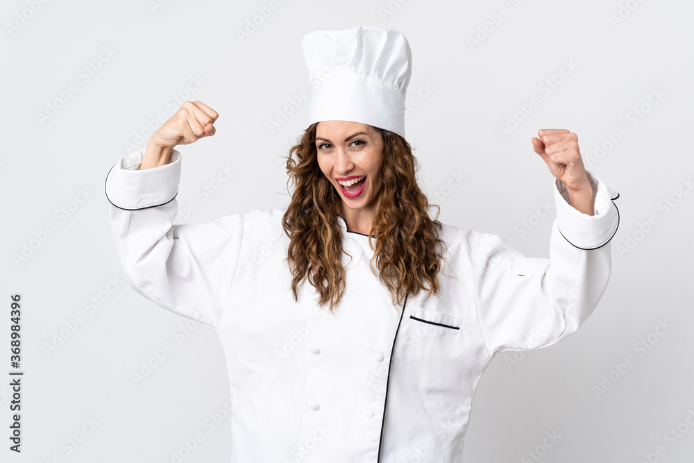 Young chef woman isolated on white background doing strong gesture Young chef woman isolated on white background doing strong gesture