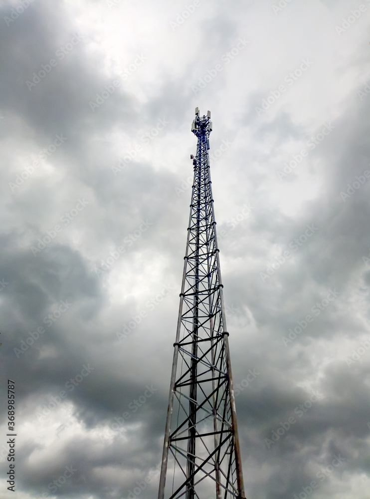 Telecommunication antenna In the evening the gray sky backdrop Telecommunication antenna In the evening the gray sky backdrop