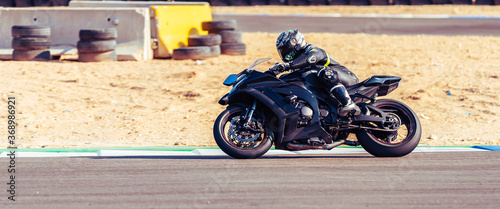 Fotografia, Obraz motorcycle racer rides on a sports track
