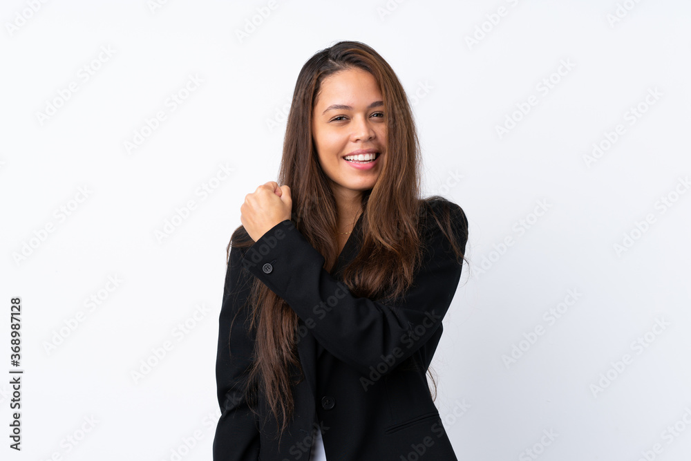 Young Brazilian girl with blazer over isolated white background celebrating a victory Young Brazilian girl with blazer over isolated white background celebrating a victory