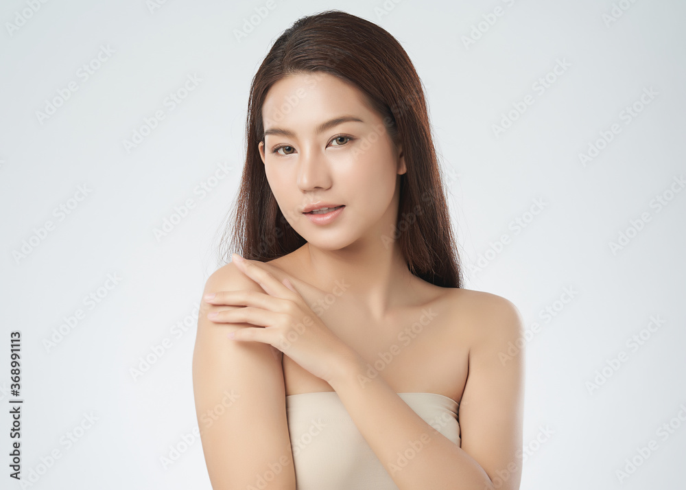 Beautiful Young asian Woman with Clean Fresh Skin on white background, Face care, Facial treatment, Cosmetology, beauty and spa, Asian women portrait Beautiful Young asian Woman with Clean Fresh Skin on white background, Face care, Facial treatment, Cosmetology, beauty and spa, Asian women portrait