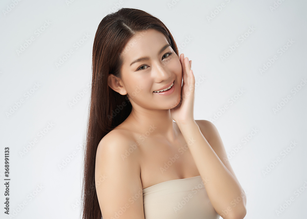 Beautiful Young asian Woman with Clean Fresh Skin on white background, Face care, Facial treatment, Cosmetology, beauty and spa, Asian women portrait Beautiful Young asian Woman with Clean Fresh Skin on white background, Face care, Facial treatment, Cosmetology, beauty and spa, Asian women portrait