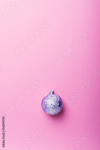 Christmas violet ball on the pink background