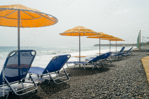 Summer holidays season 2020. Beach without people. Beach, summer, Covid-19, vacation. Empty sunbeds on a beach. Summer vacation and Covid-19