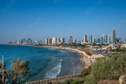 Landscape of Mediterranean sea beach and skyline of Tel Aviv. © borisbelenky
