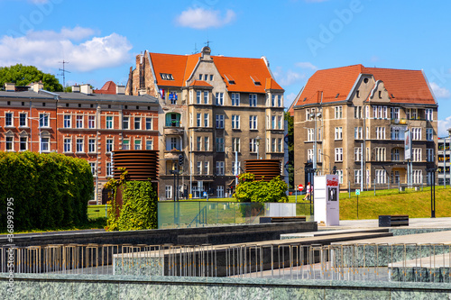 Solidarnosci square and surrounding tenement houses in old Gdansk Shipyard quarter in front of European Solidarity Centre in Gdansk, Poland