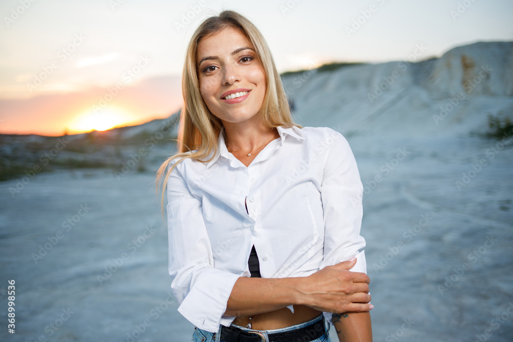 Young woman with healthy teeth posing outdoors