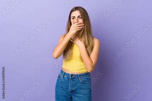 Young woman over isolated purple background coughing a lot