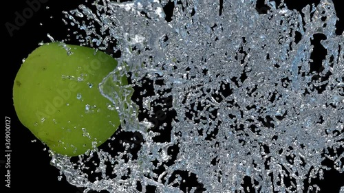 Realistic render of a green Granny Smith Apple hitting a water splash in super slow motion. Presented on transparent background (with alpha channel) 
